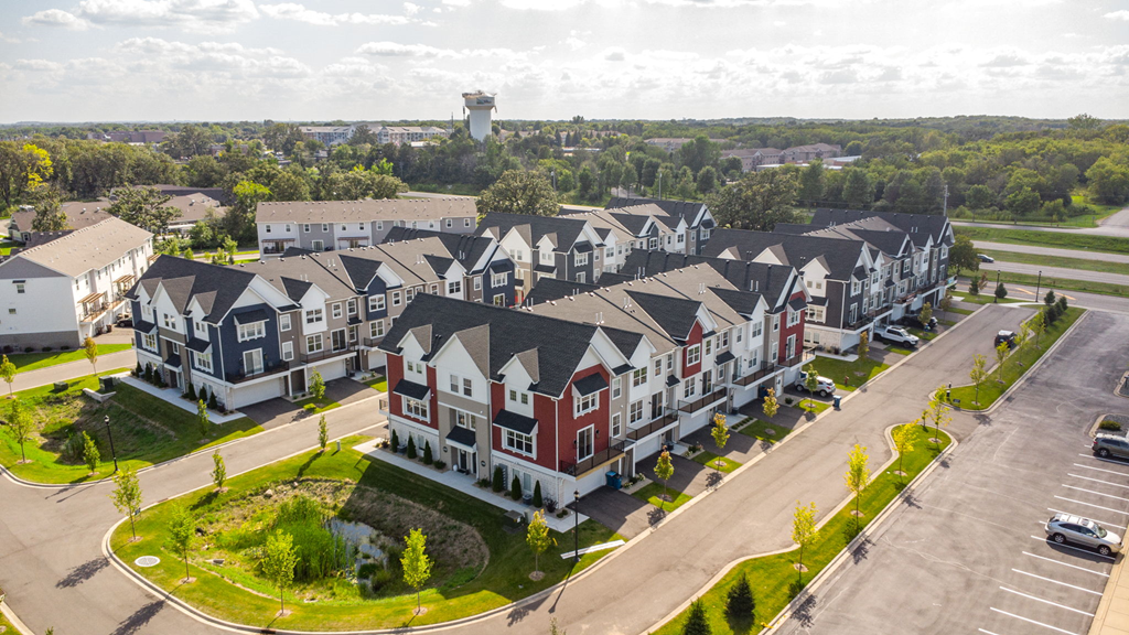 an aerial view of multiple townhouses in a neighborhood