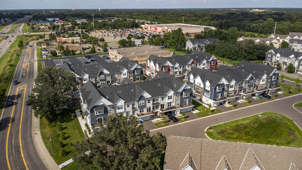 an aerial view of townhouses in a suburban neighborhood