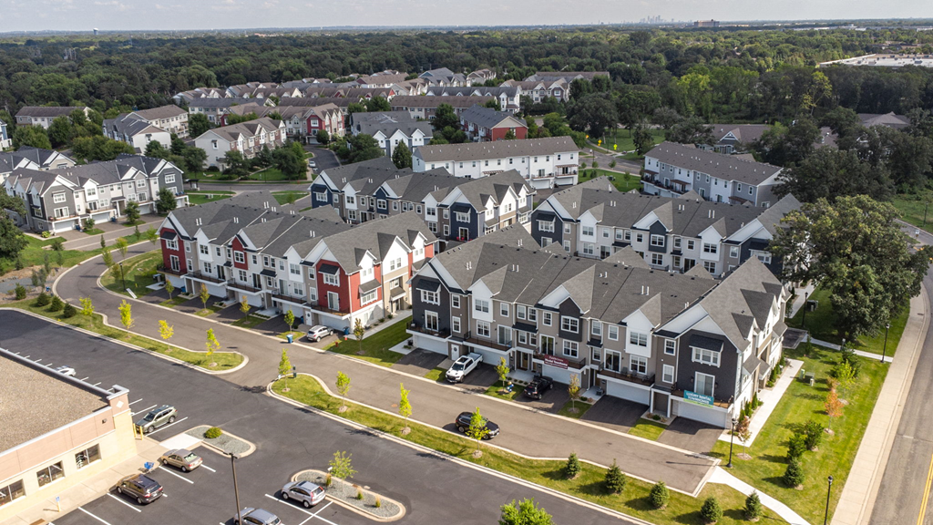 an aerial view of an apartment complex in a suburb