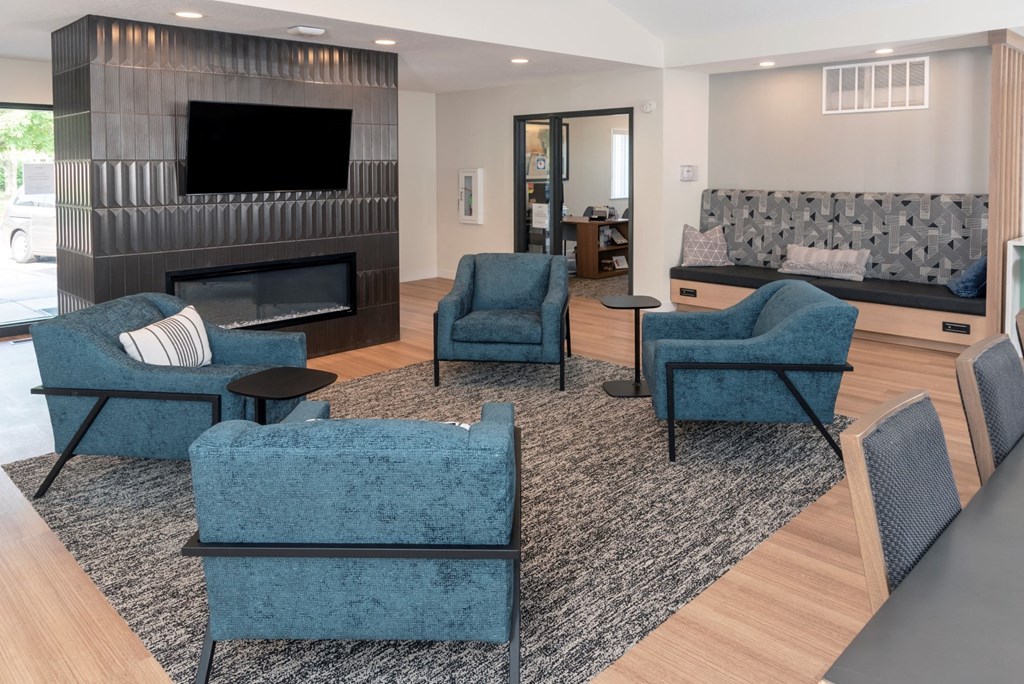 a living room filled with furniture and a fire place