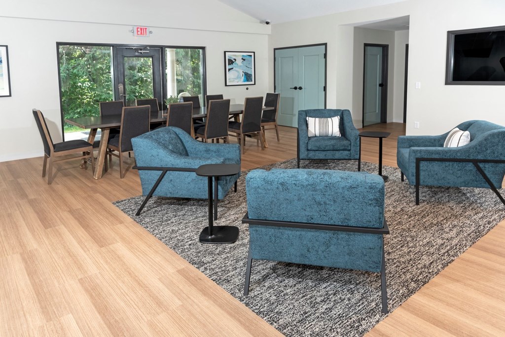 a living room filled with furniture and a large window