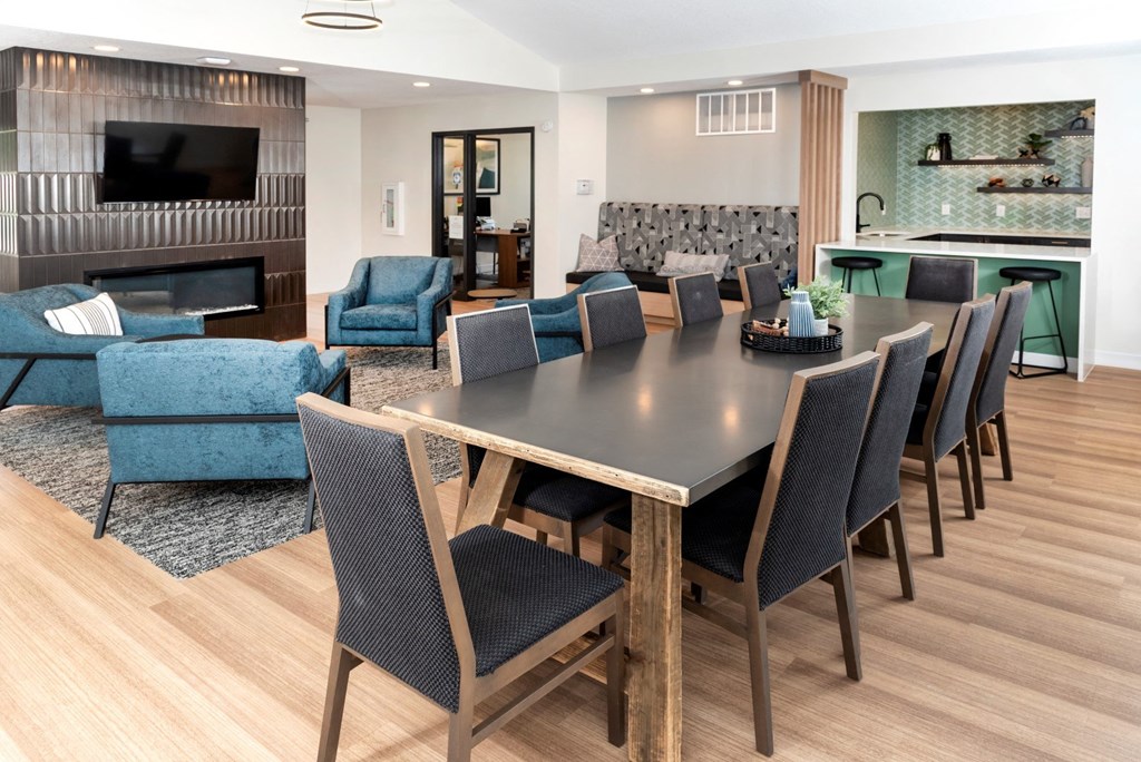 a living room filled with furniture and a flat screen tv