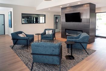 a living room filled with furniture and a fire place