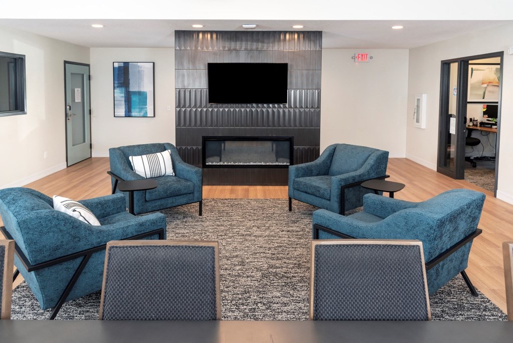 a living room filled with furniture and a fire place