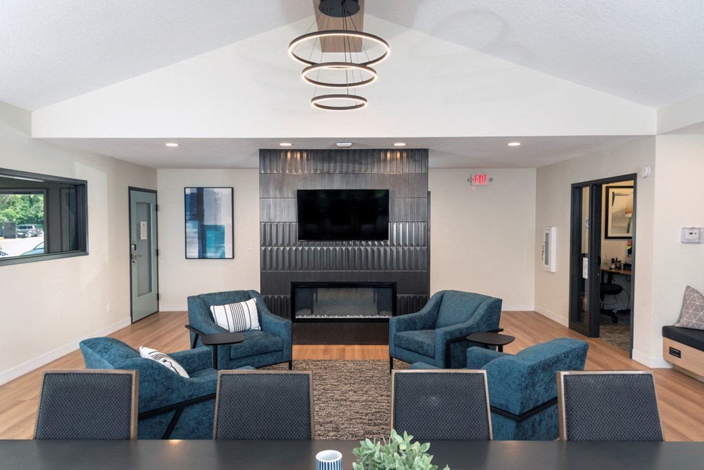 a living room filled with furniture and a fire place