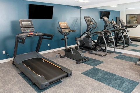 a room filled with lots of exercise equipment