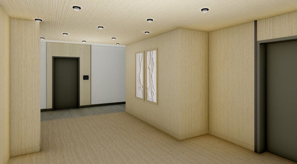 an empty room with two paintings on the wall  at The Ansel Residences, Vadnais Heights