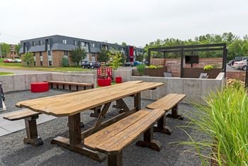 a picnic table in front of a building