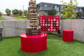 a giant jenga game on a lawn
