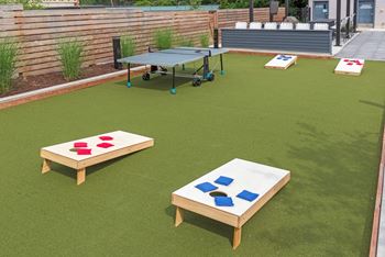 a games area with ping pong tables