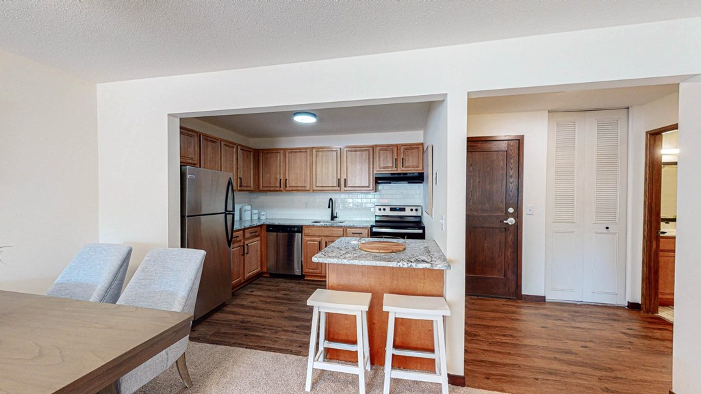 Upgraded kitchen featuring stainless steel appliances at Hillsborough Apartments at Hillsborough Apartments, Minnesota, 55113