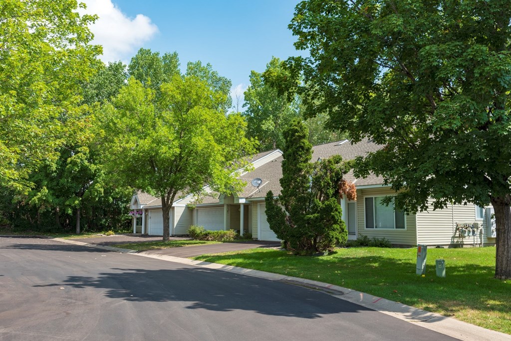 a street in front of a row of houses