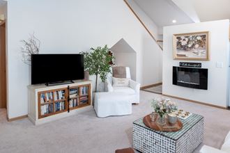 a living room filled with furniture and a flat screen tv - Photo Gallery