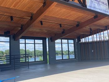 a view of the lake from the inside of the building
