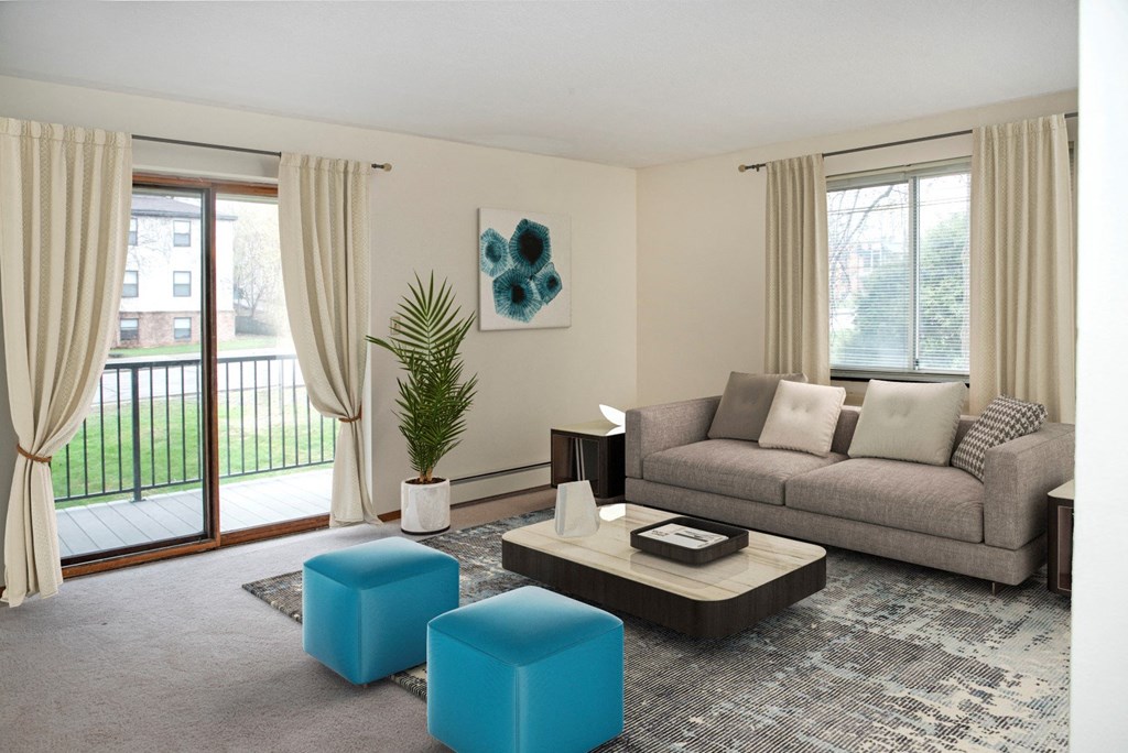 a living room with a gray couch and blue stools