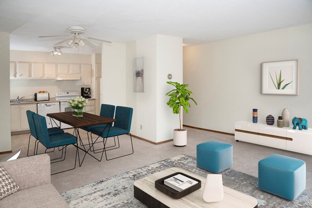 a living room with a dining room and a kitchen with a table and chairs