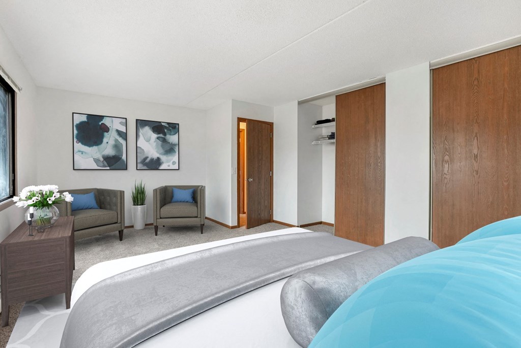 a bedroom with a bed and a door to a bathroom