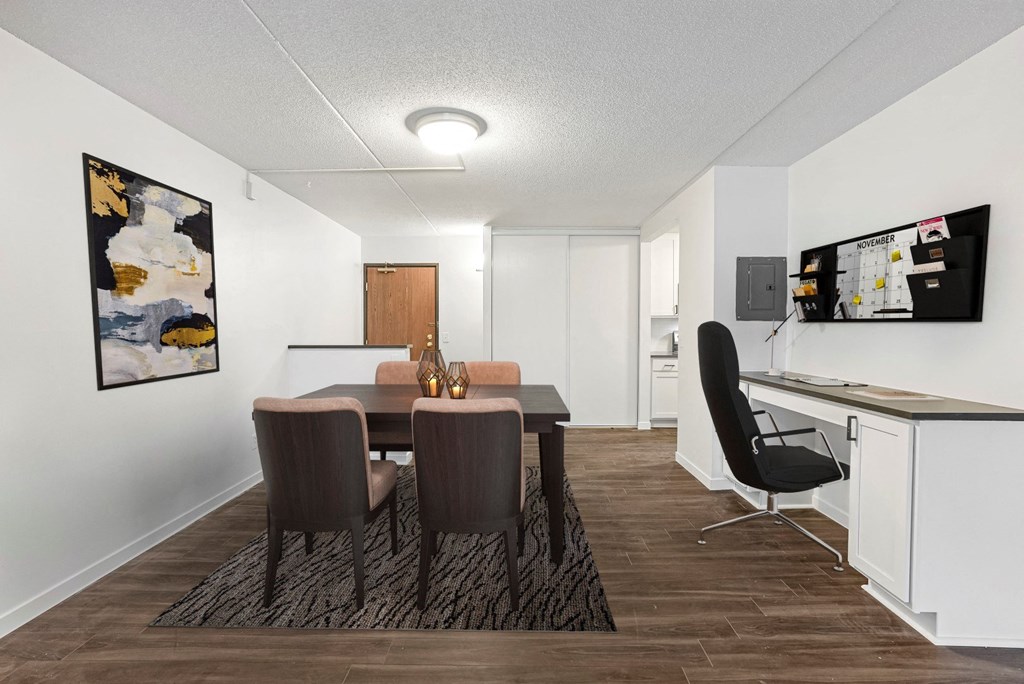 a dining room with a table and chairs