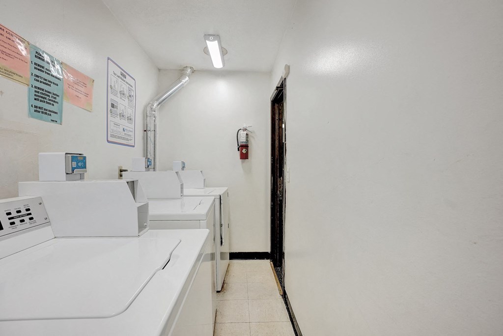 the laundry room is equipped with washers and dryers
