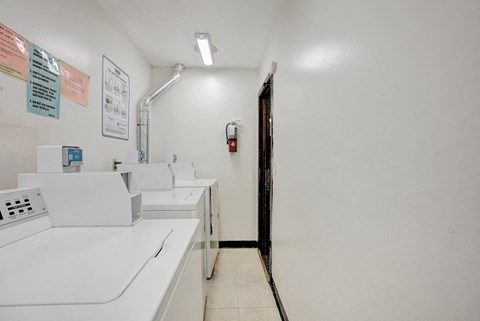 the laundry room is equipped with washers and dryers