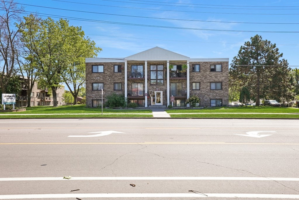 an apartment building on the corner of a street