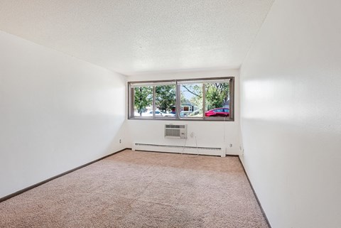 the living room of a house with a large window