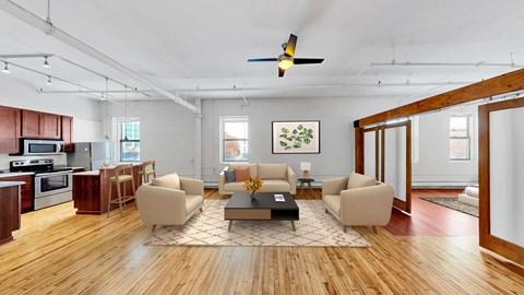 A living room with a brown sofa and a coffee table.