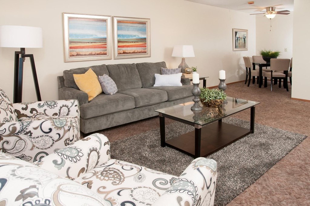 a living room with couches and a coffee table