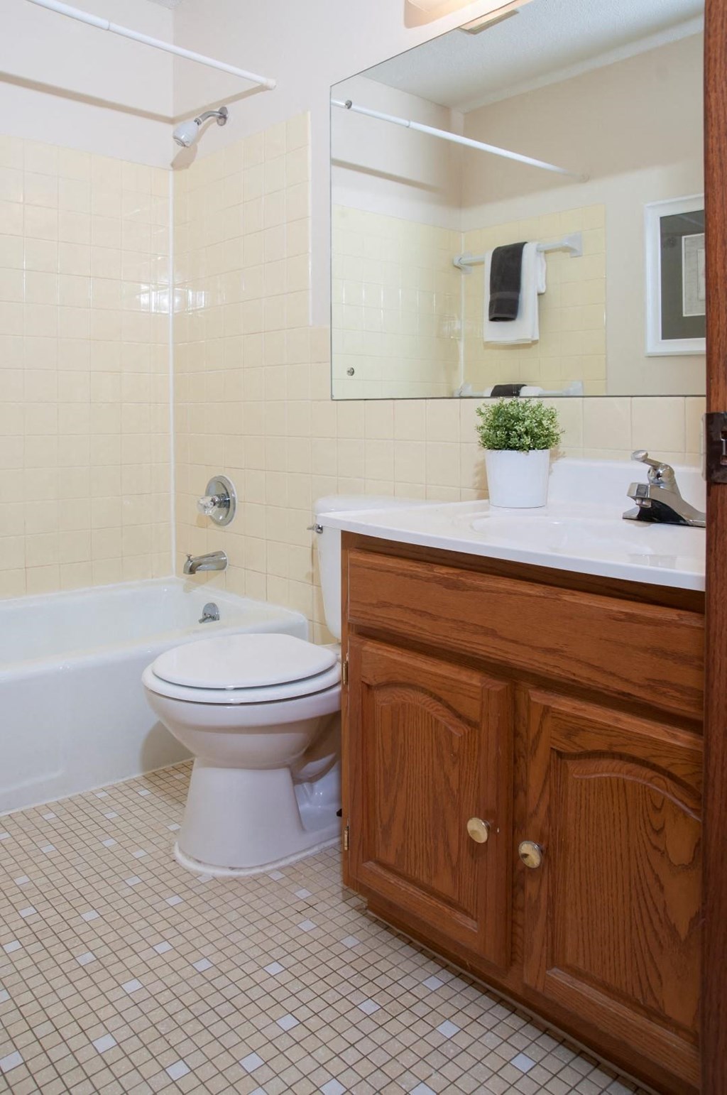 a bathroom with a toilet and a sink and a bath tub