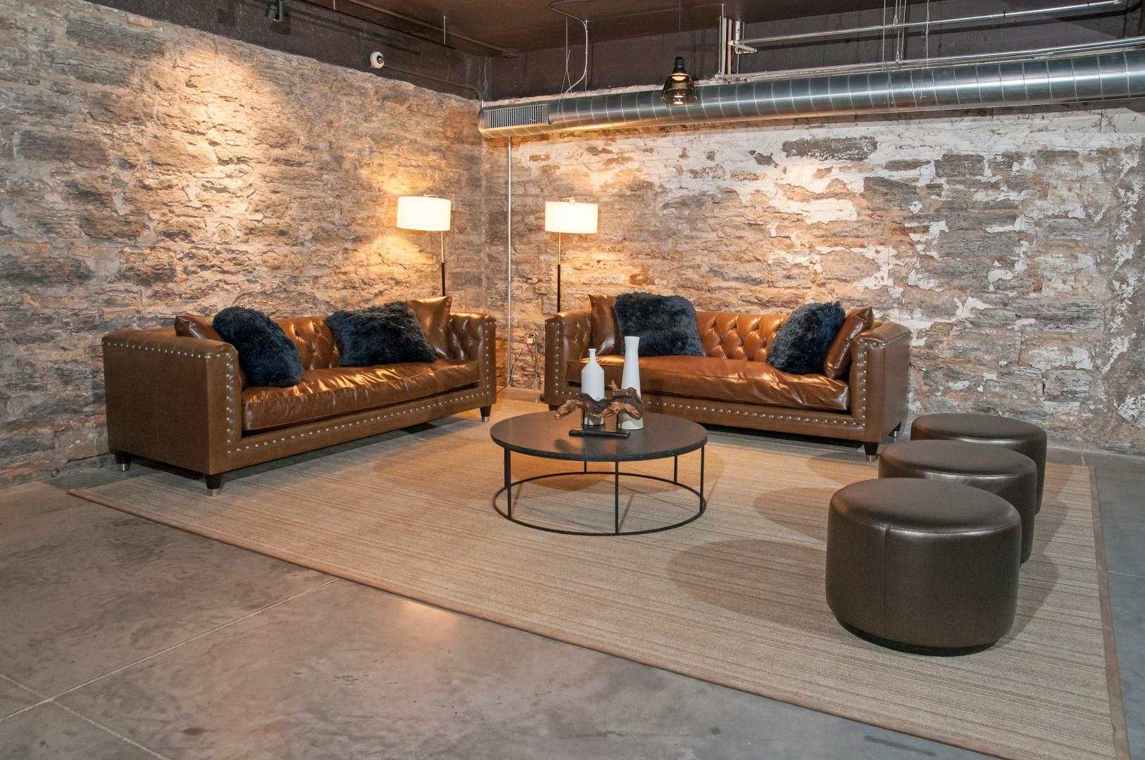 Large Brown Sofas Around Circle Table in Club Room at 700 Central Apartments, Minnesota, 55414