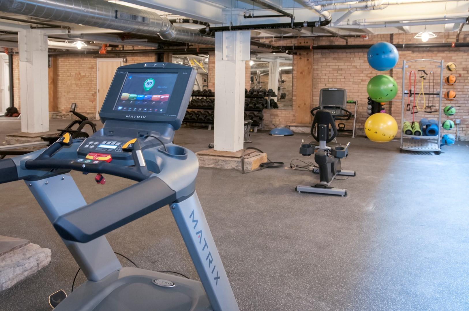 Fitness Center with Multiple Fitness Machines and Materials at 700 Central Apartments, 700 Central Avenue, Minneapolis