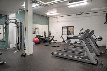 A gym with treadmills, exercise balls, and weightlifting equipment.at Gurley Lofts, Minnesota, 55401