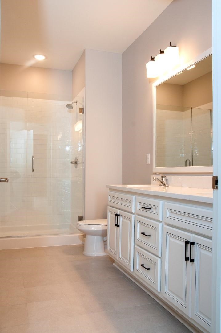 Bathrooms with Glass-Enclosed Showers at Residences at 1700, Minnetonka, MN