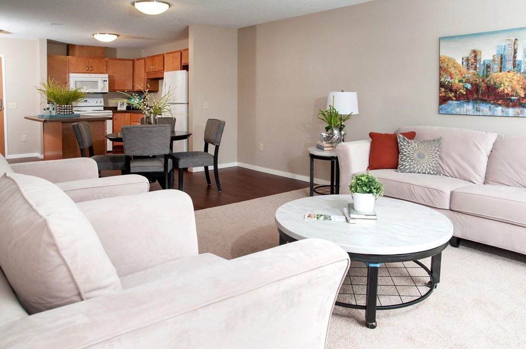 a living room with couches and a table