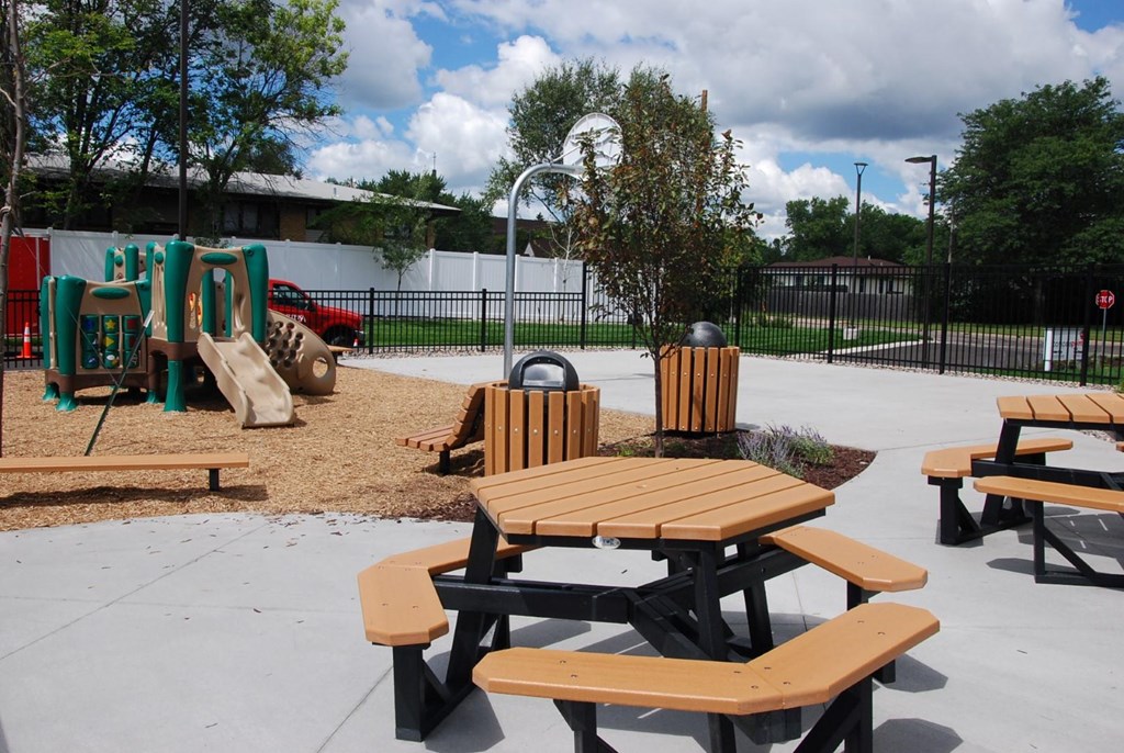 a picnic table at a playground at a park