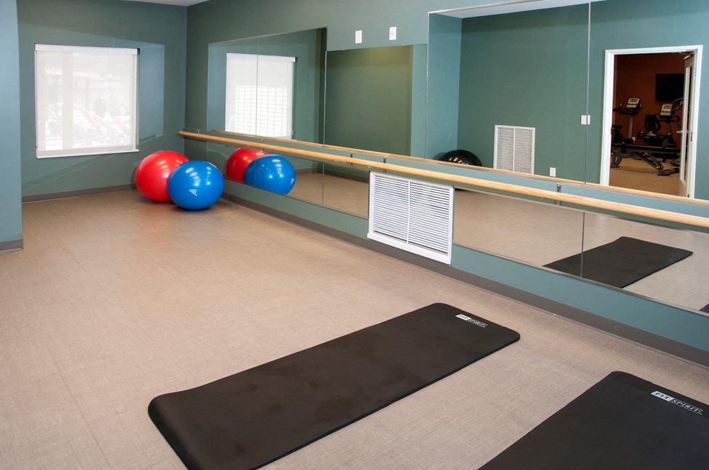 a bowling alley with bowling balls and a mirror