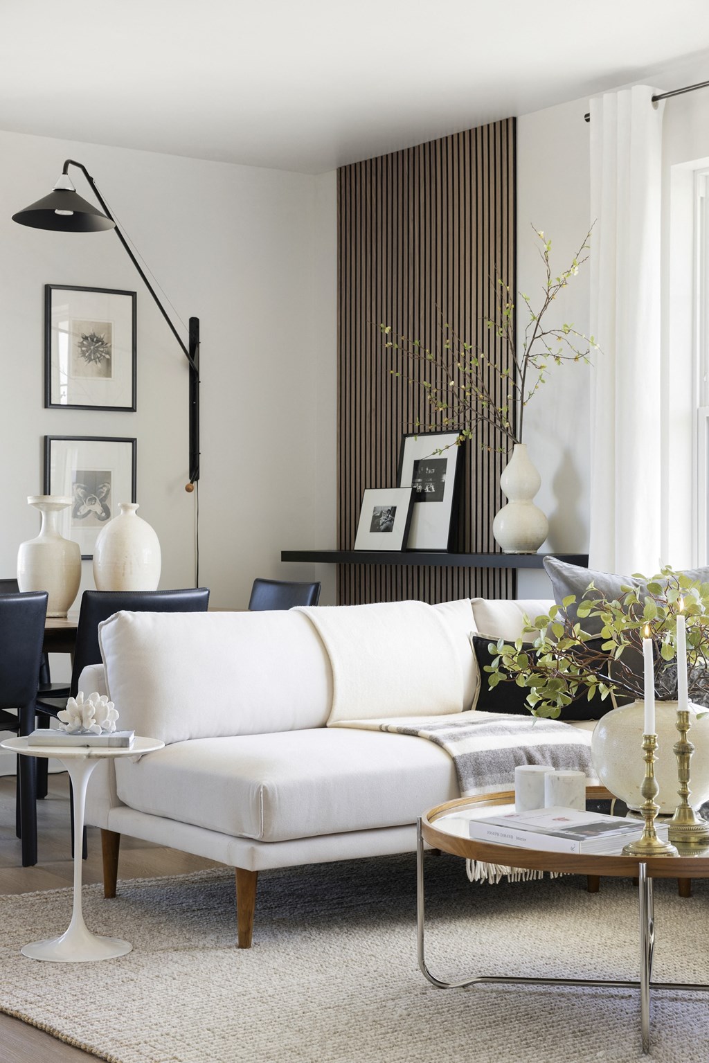 a living room with a white couch and a coffee table