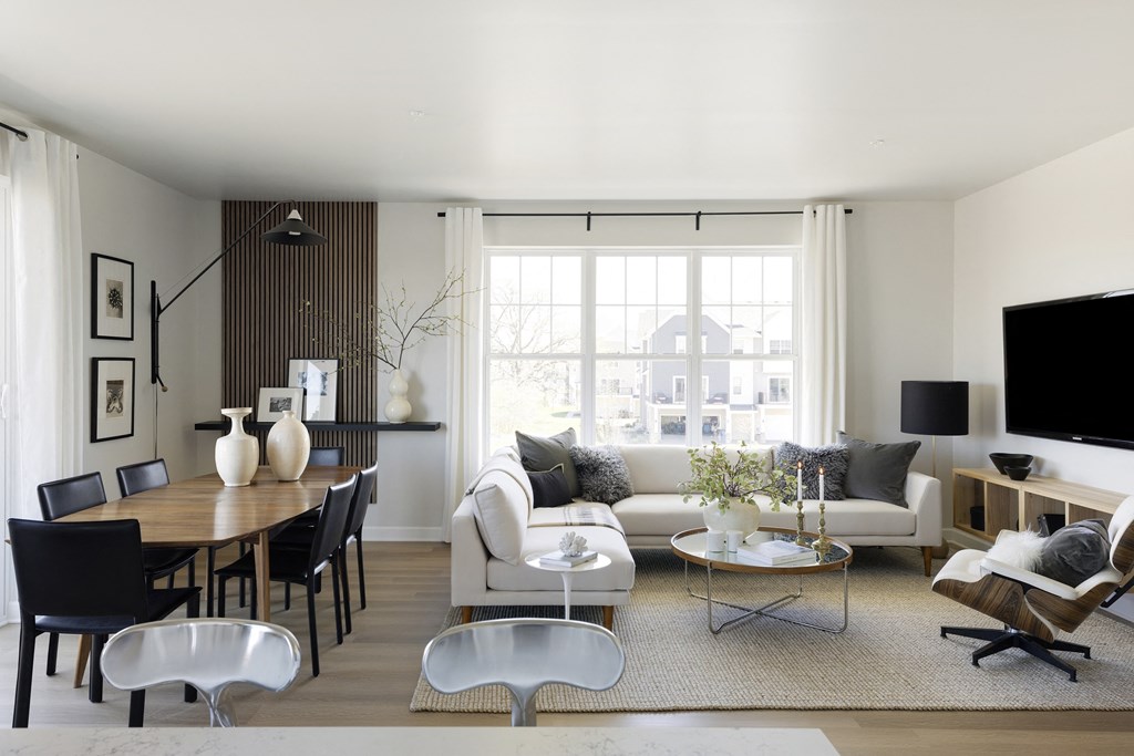 a living room with a couch and a table and a television