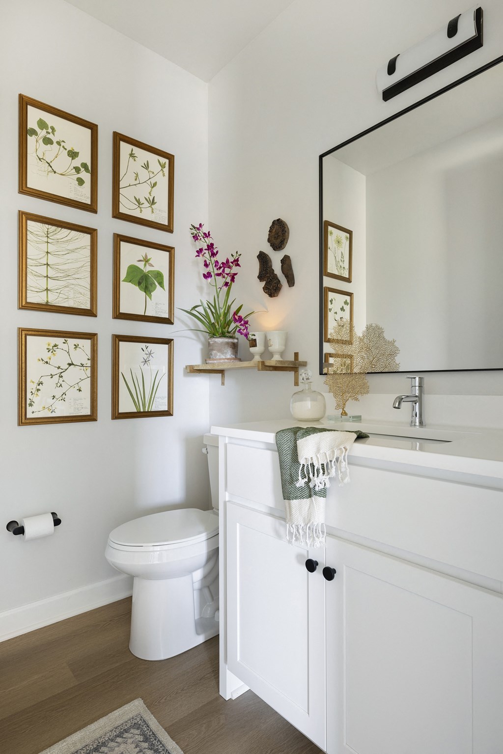 a bathroom with a toilet and a sink and a mirror