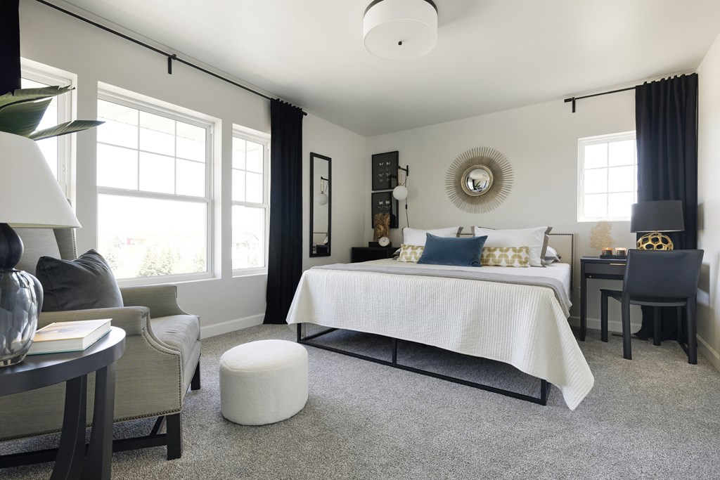 a bedroom with a bed and a living room