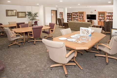 library with seating for puzzles and games