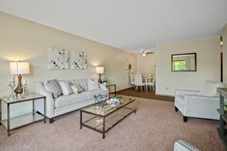 a living room with a couch and a chair