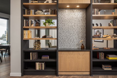 A bookshelf with books and decorative items is shown.
