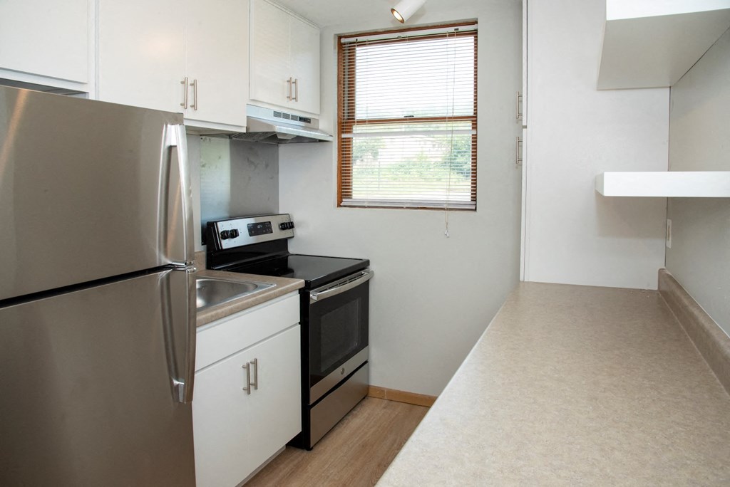 studio kitchen with floating shelves