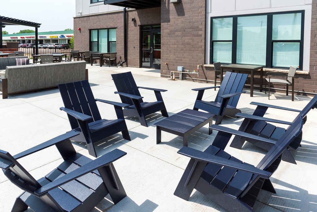 outdoor patio with fire pit and seating  at Shady Oak Crossing, Minnesota, 55343
