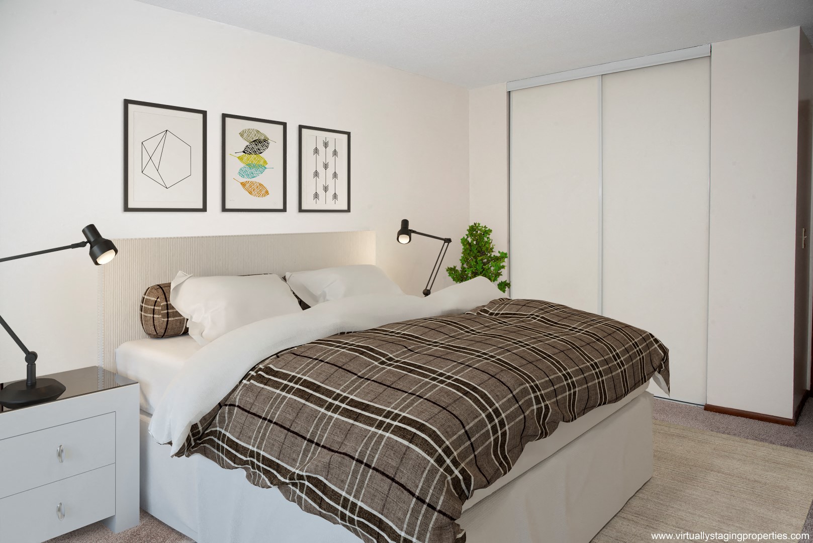 a bedroom with a bed and some pictures on the wall