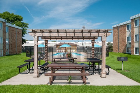 our apartments have a picnic area with benches and tables