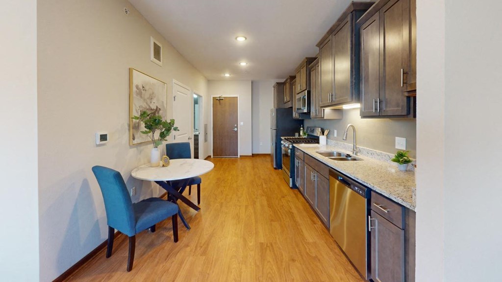 a kitchen and dining room at The Yards and Backyards, South St. Paul, 55075