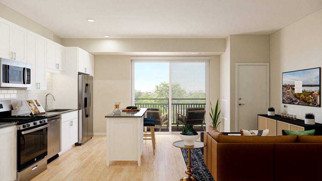 a kitchen and living room in a 555 waverly unit at The Gateway at West Lake Quarter in Minneapolis, MN