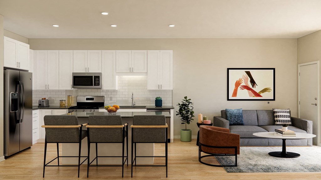 a living room and kitchen area with a large painting on the wall at The Gateway at West Lake Quarter in Minneapolis, MN